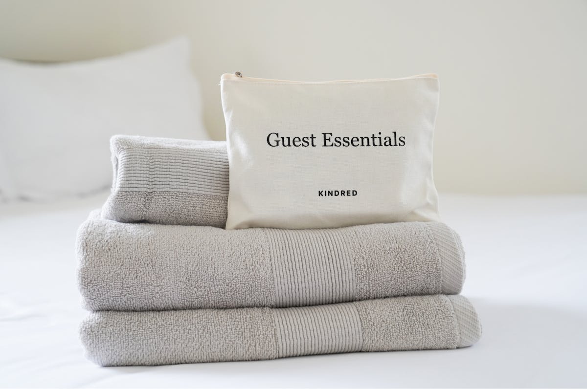 Kindred’s welcome kit, featuring premium linens, luxurious Aesop toiletries, and other must-have essentials.