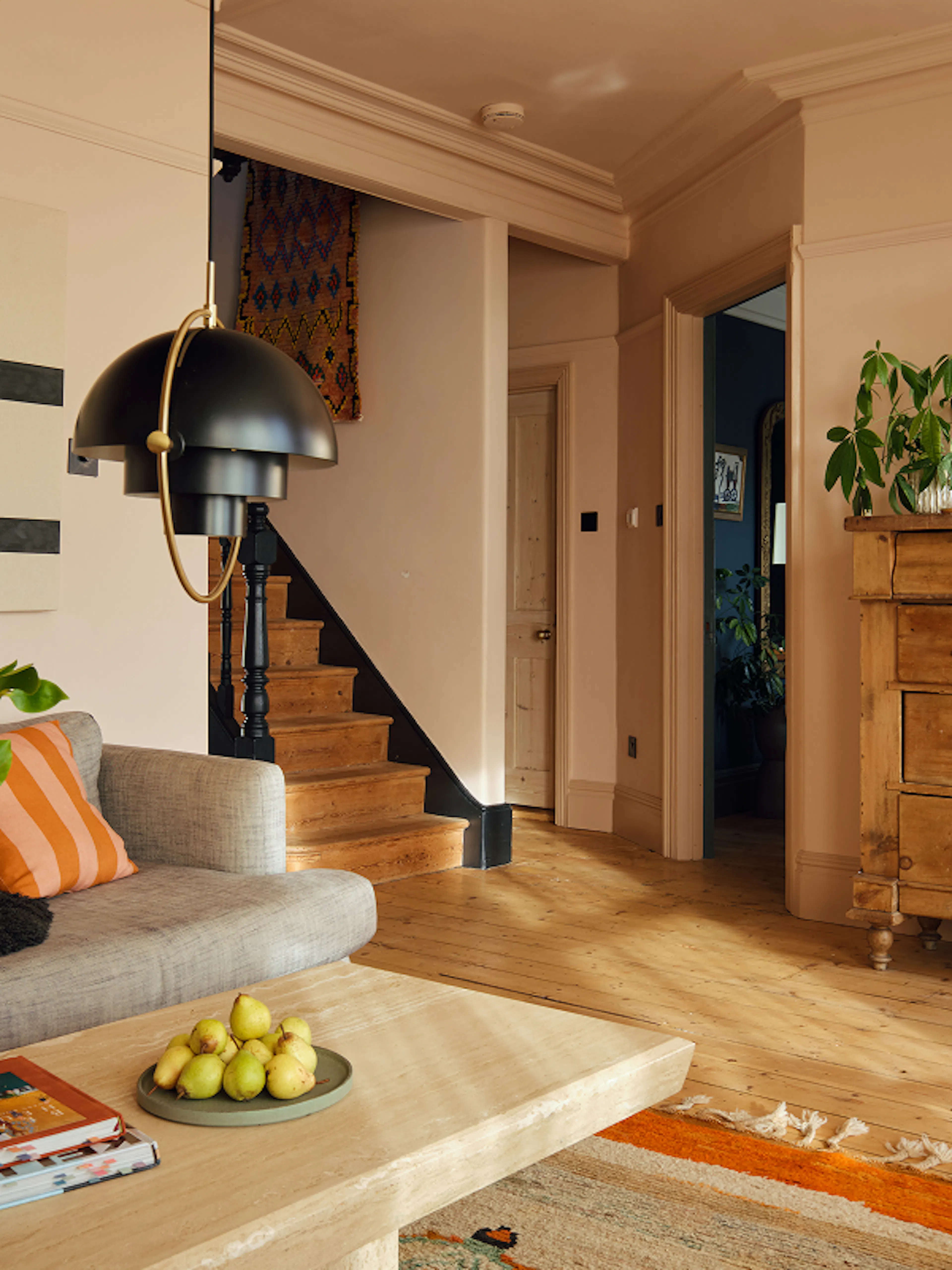 Living room and staircase inside a Kindred home
