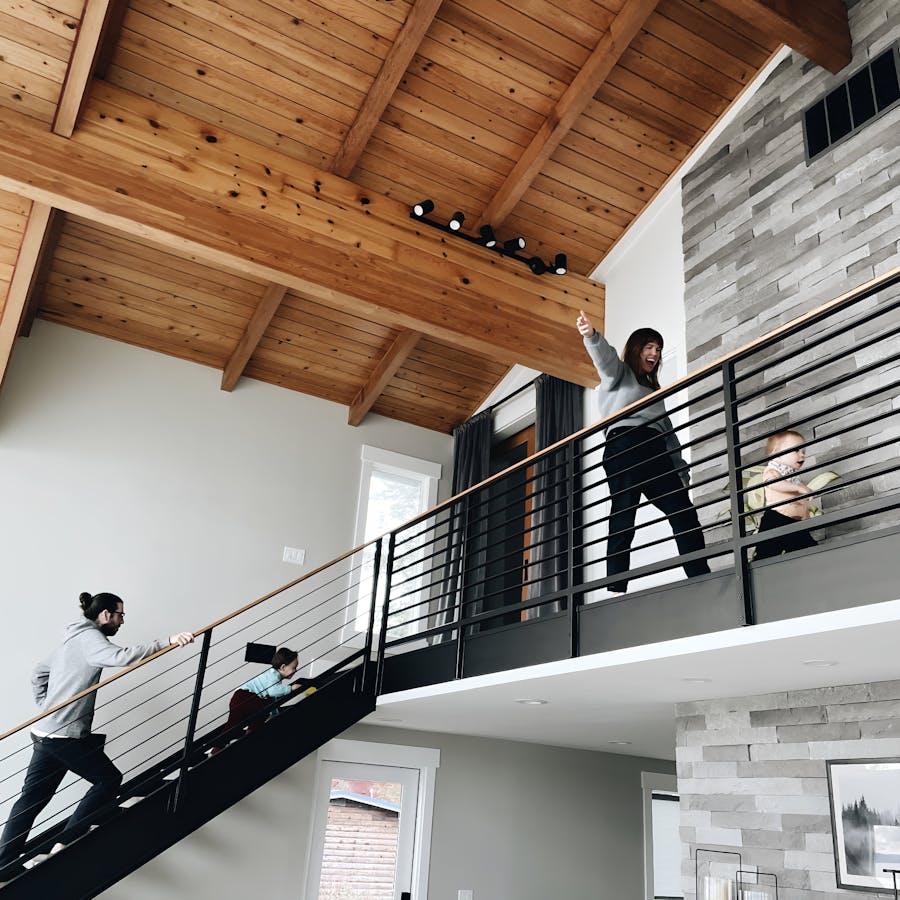 Family enjoying a modern Kindred home, confident in the protection provided by comprehensive host protection, trip protection, and professional cleaning services. Kindred’s focus on safety, security, and cleanliness ensures a worry-free home swapping experience for families.