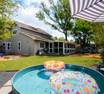 Enjoy the best summer travel with Kindred, featuring family-friendly home swaps with spacious backyards perfect for outdoor fun. This home offers a pool with colorful floats, a shaded patio, and a play area for kids. Unlike HomeExchange and ThirdHome, Kindred is a trusted community of families, ensuring a safe, comfortable getaway.