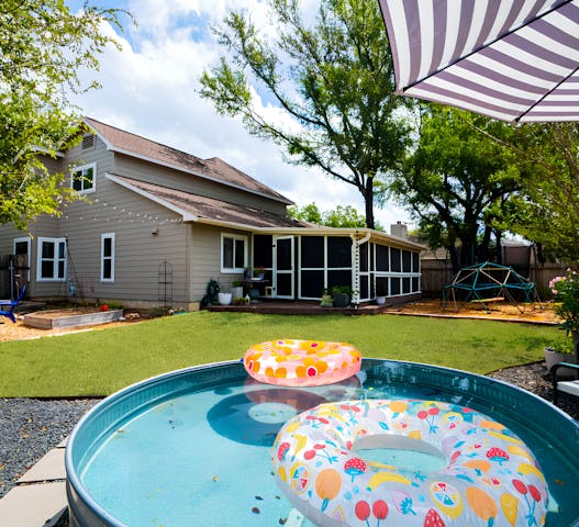 Enjoy the best summer travel with Kindred, featuring family-friendly home swaps with spacious backyards perfect for outdoor fun. This home offers a pool with colorful floats, a shaded patio, and a play area for kids. Unlike HomeExchange and ThirdHome, Kindred is a trusted community of families, ensuring a safe, comfortable getaway.