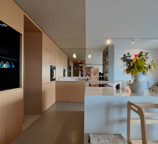Bright and modern kitchen with wooden cabinetry and a cozy dining area in Upstate, available through Kindred home swapping for $21 per night.