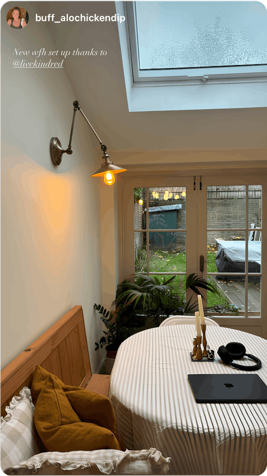 A bright, cozy home office in a New York apartment, where a remote worker enjoys the flexibility of home swapping—an affordable, community-driven alternative to short-term rentals.
