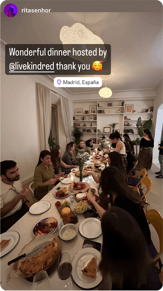 A lively dinner gathering in Madrid, showcasing the connections made through home exchange—where travelers find welcoming spaces and shared experiences beyond hotels.