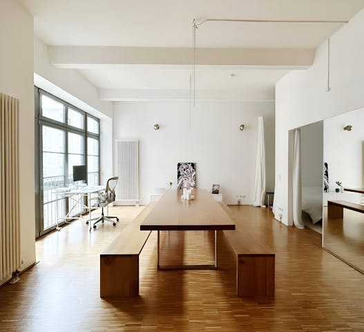 Minimalist office space in a Kindred home, designed for remote workers who value simplicity and focus, offering a clutter-free environment ideal for staycations or long-term stays.