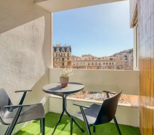 Private urban balcony with city views, perfect for empty nesters looking for a change of scenery and an affordable staycation through a Kindred home exchange.