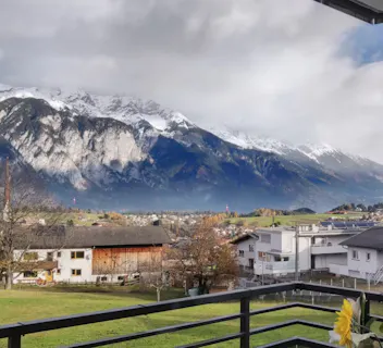 Mountain-view balcony offering tranquility, perfect for retirees seeking outdoor escapes, hiking opportunities, and stress-free travel with Kindred home swaps.