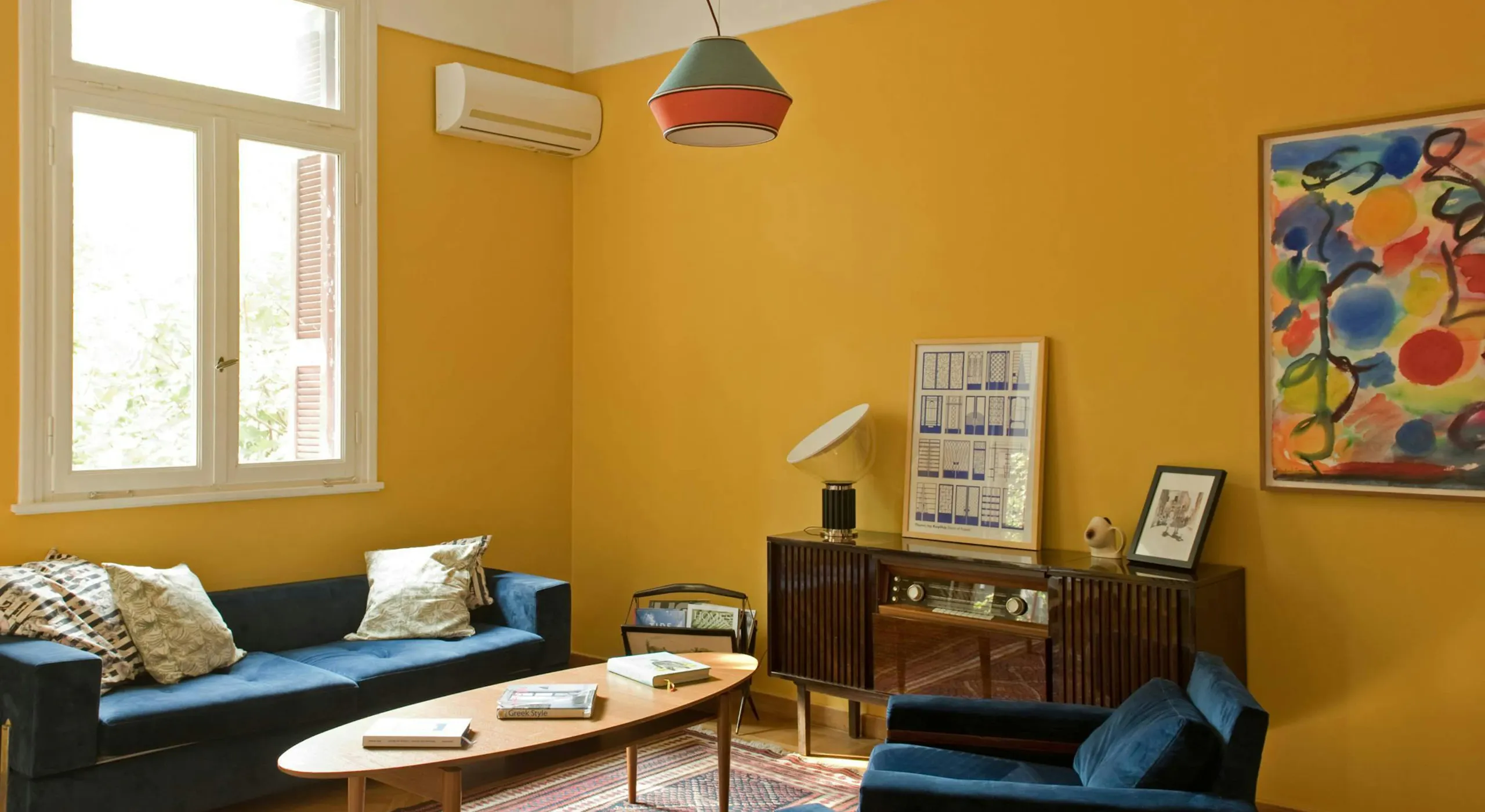 Discover affordable, authentic San Francisco living in a real home, not a hotel. This sun-drenched, budget-friendly home features a stylish wooden dining table, distinct art, comfortable pillows, and spacious rooms, perfect for those seeking a unique and cost-saving Kindred home swap experience in San Francisco.