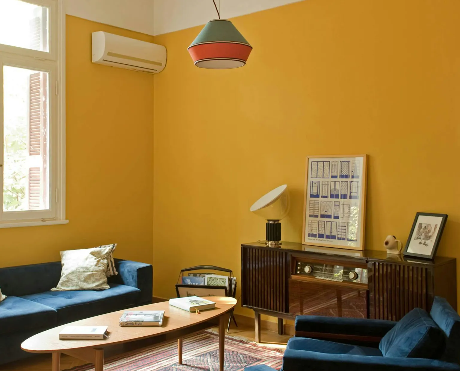 Discover affordable, authentic San Francisco living in a real home, not a hotel. This sun-drenched, budget-friendly home features a stylish wooden dining table, distinct art, comfortable pillows, and spacious rooms, perfect for those seeking a unique and cost-saving Kindred home swap experience in San Francisco.