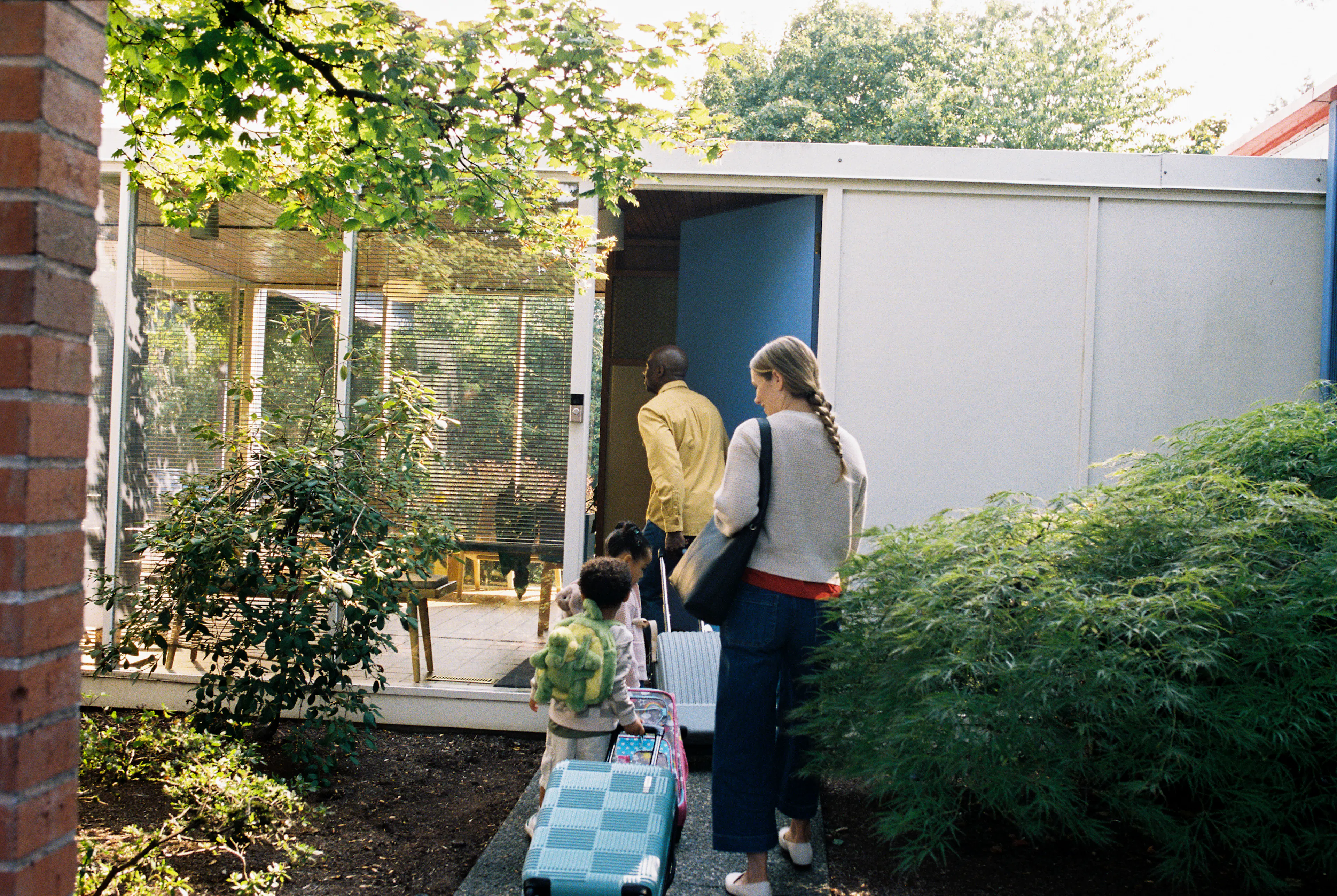 A family entering a vacation home